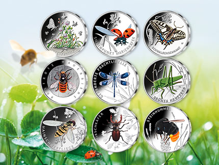 Illustration of colour print coins with green meadow and butterfly as background